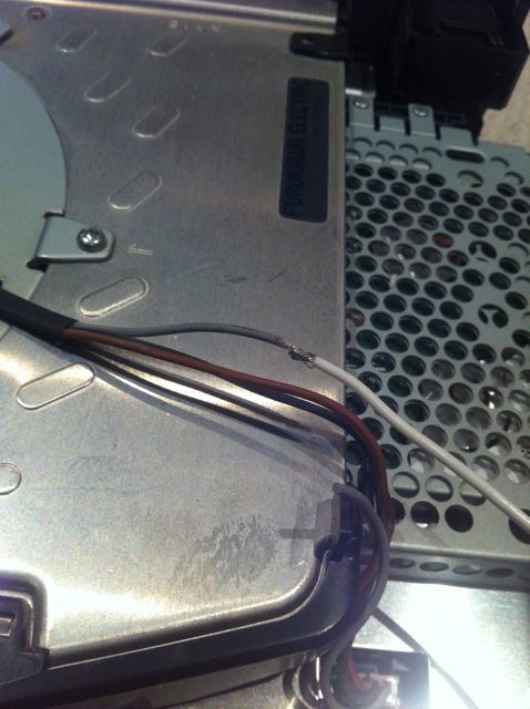 Pic #2 - Cut the grey wire, and connect your new wire to the cut wire leading to the fan.

re-jigging the fan to run at max speed (12v) -2